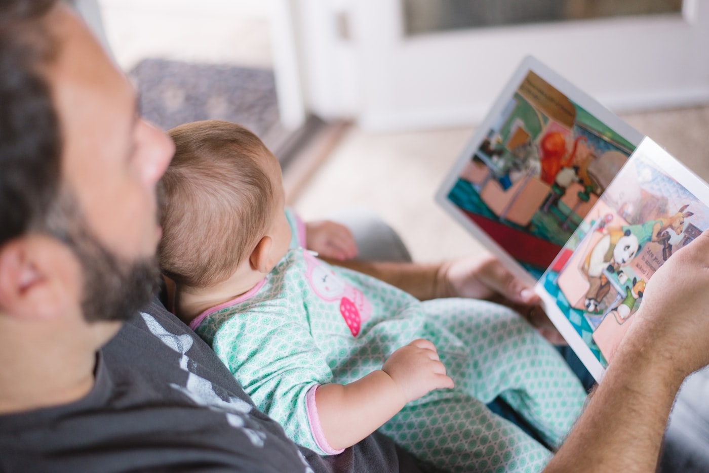 A family reading a book together.